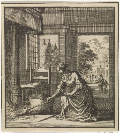 Woman shovelling the ashes from the fireplace
