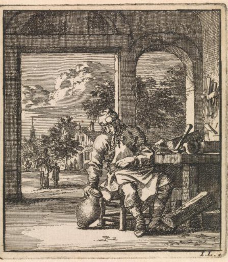A man sitting next to a workbench with a jug
