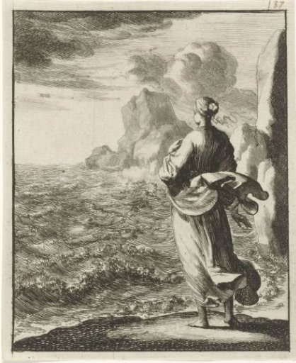 Woman looking out to sea from the shore
