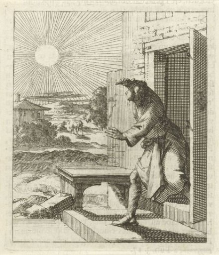 Man shielding his eyes from the sun as he walks outside