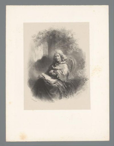 Older woman with a book in an armchair in a garden