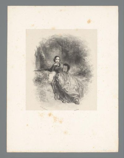 Young woman seated in a forest