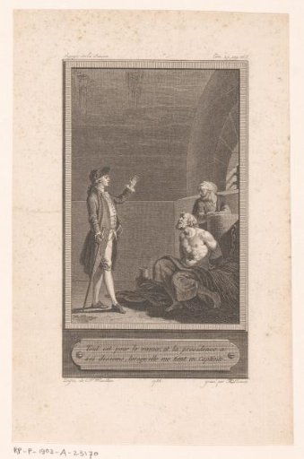 Man standing before a chained prisoner in a dungeon