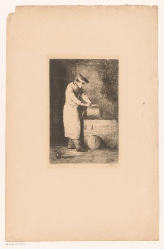 Dark interior with a man cleaning a pan