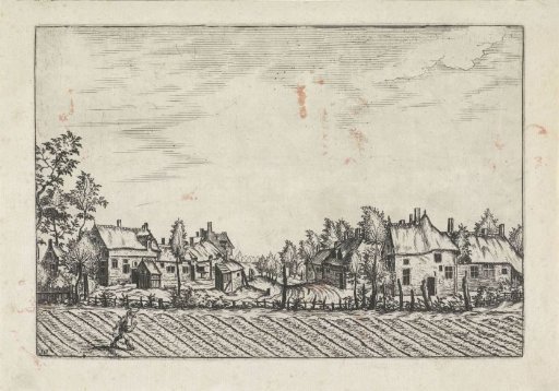 Farmhouses near a ploughed field