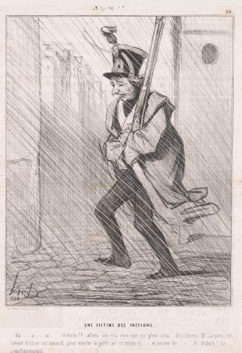 Soldier of the National Guard patrols through the rain