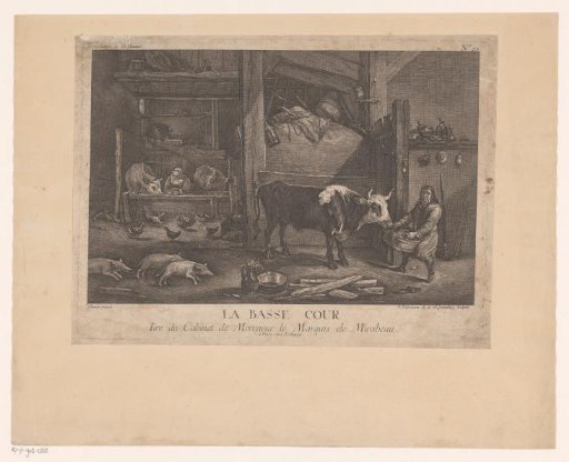 Peasants feeding cattle in a stable