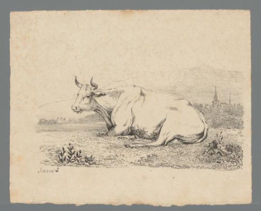 Cow lying in the grass