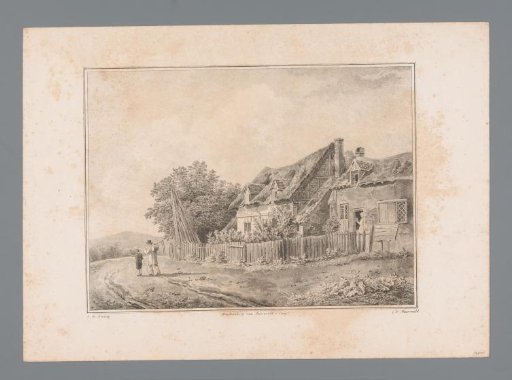 Man and boy walking on a path next to houses