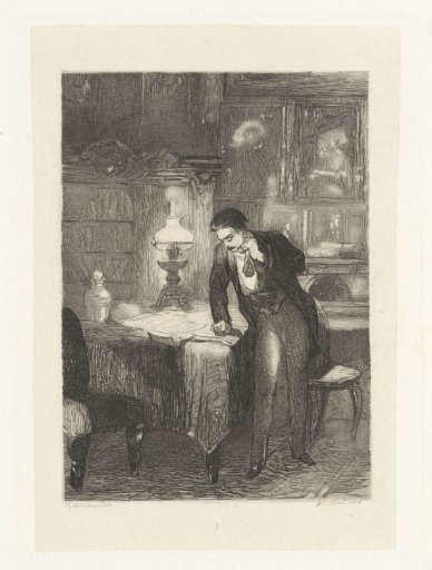 Man standing by a table with papers