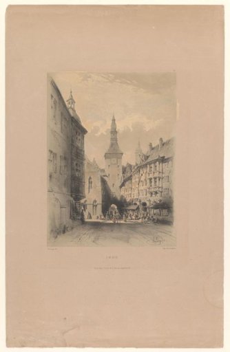 View of a street with church tower in Munich