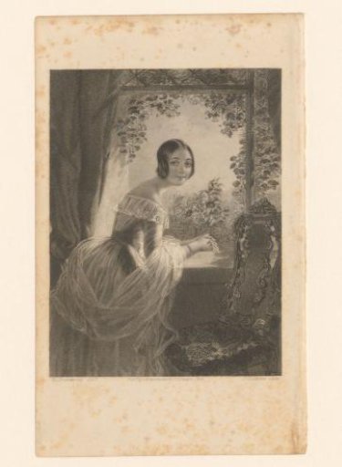 Young woman at a window with a view of a garden