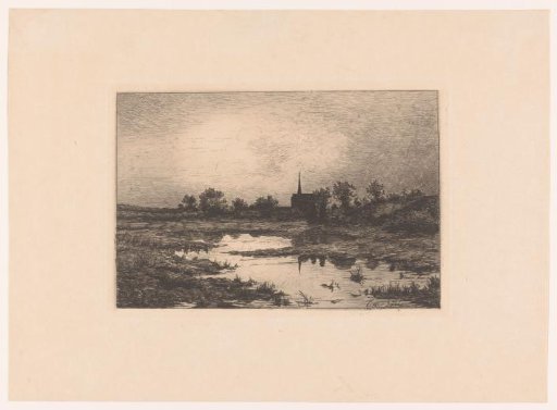 Village church in the evening by a lake