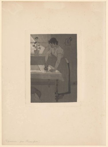 Woman ironing a shirt on a table