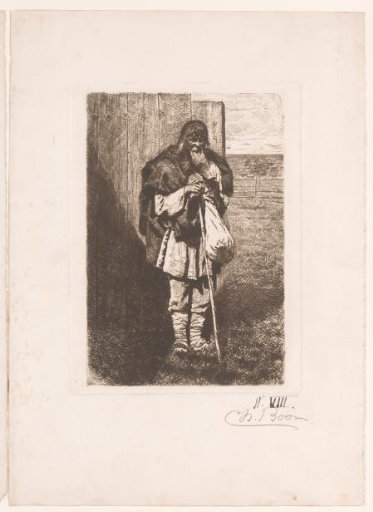 Old man with a bundle in front of a fence