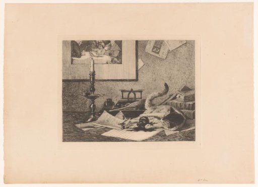 A playing cat knocks an inkpot over on the table