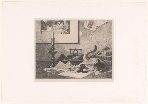 A playing cat knocks an inkpot over on the table