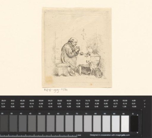 Praying man at a table