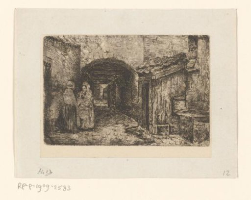 Two women on the street at a gate