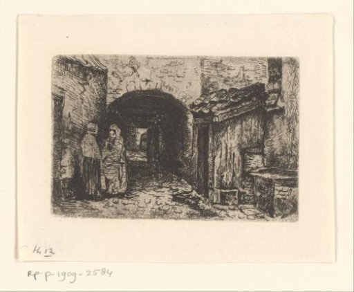 Two women on the street at a gate