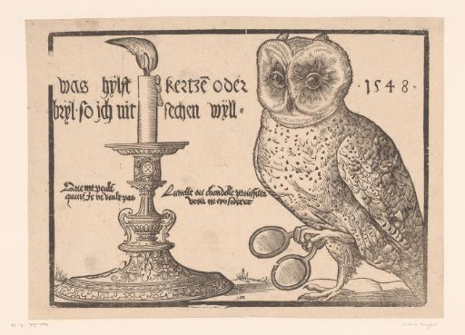 Owl with spectacles beside a burning candle