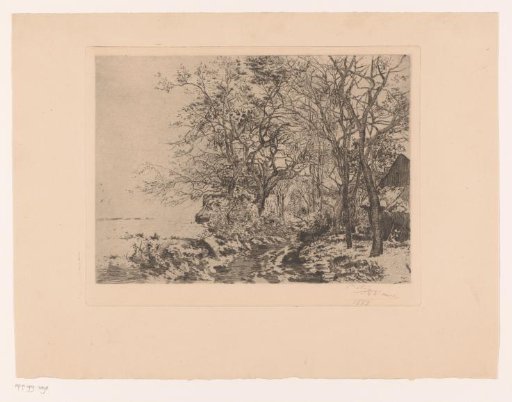 Snow landscape with a barn at the edge of the woods