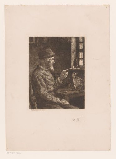 Seated man pointing at a cat on the table