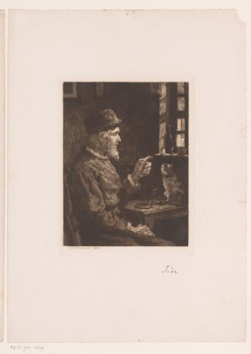 Seated man pointing at a cat on the table