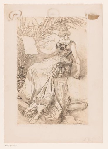 Young woman in a chair leafing through an album