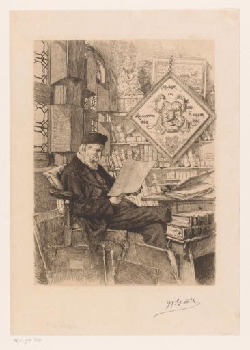 Bearded man looking at a print in a study