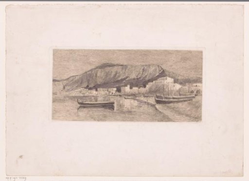 Coastal Village with a Steep Cliff Behind It