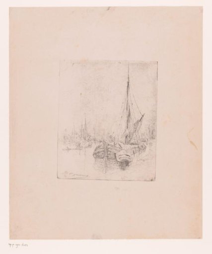 Sailing boats moored along a quay