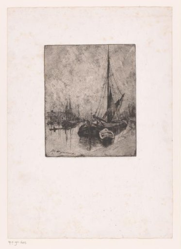 Sailing boats moored along a quay