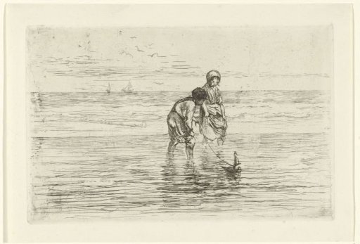 Children playing with a small boat on the beach