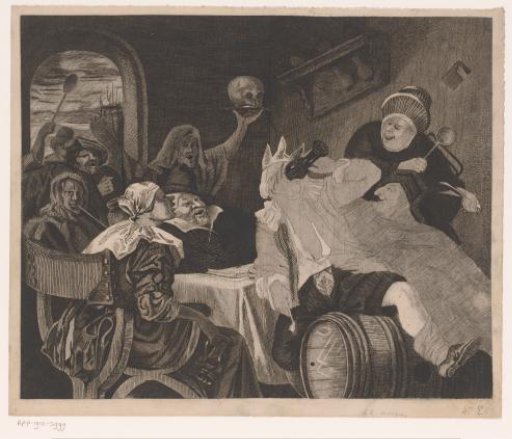 Festive company with a drinking man wearing a crown