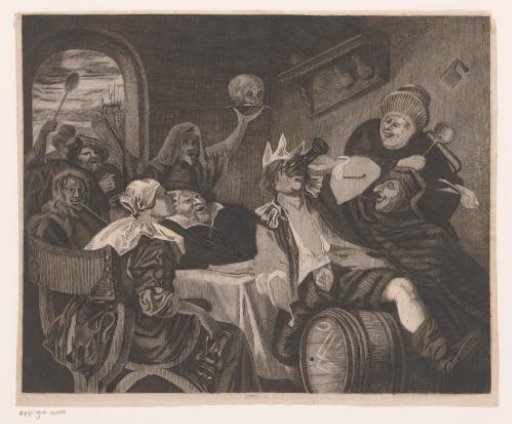 Festive company with a drinking man wearing a crown