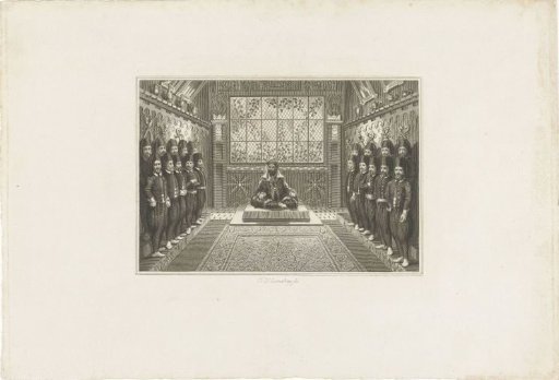 Man with a turban seated cross-legged and 19 soldiers all wearing a fez