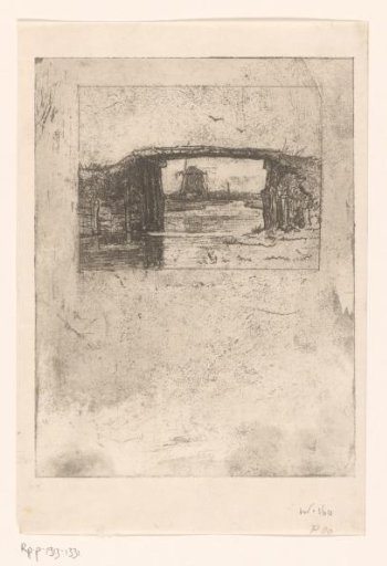 View of a mill through a bridge