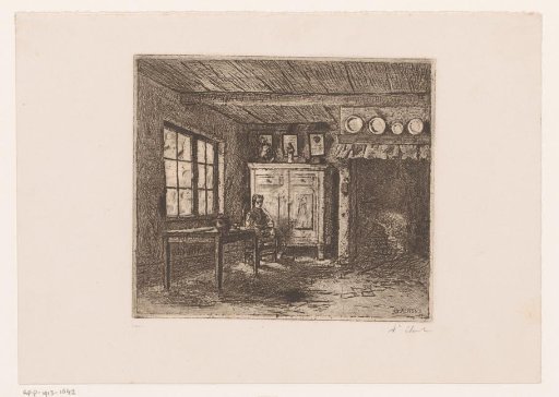 Young man seated in a room with a large fireplace