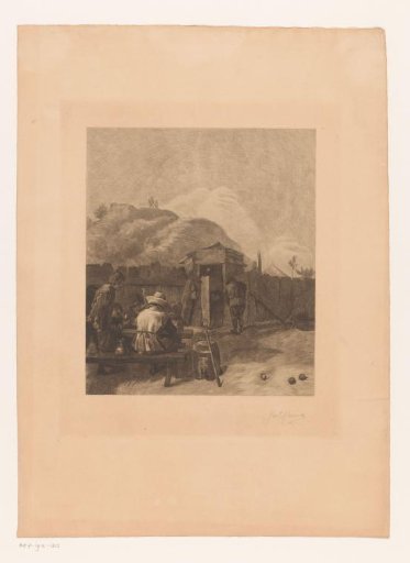 Card players outside at a table with a hill in the background