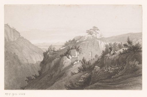 Mountain landscape with a figure carved into the rocks
