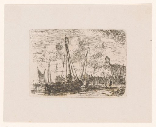 Boats on the coast near a building and pier