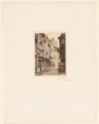 Street with a café Gauvin and medieval houses