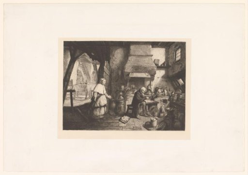 Interior with a standing woman and a man reading a book in the kitchen