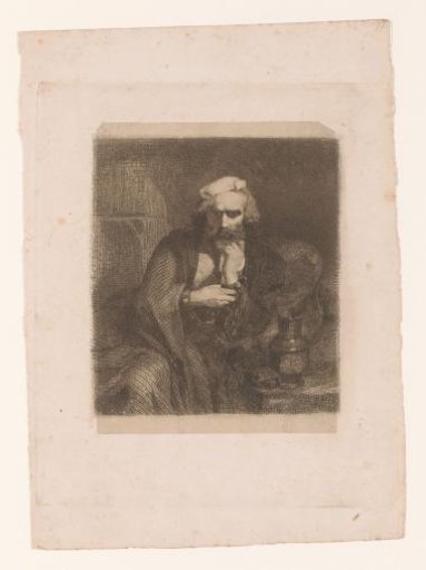 Man with chains around his hands