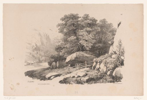 Rocky landscape with path along trees and river