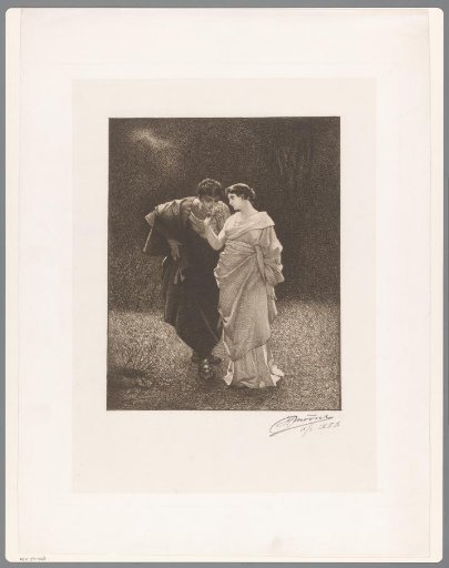 Young man smelling a flower held by a young woman