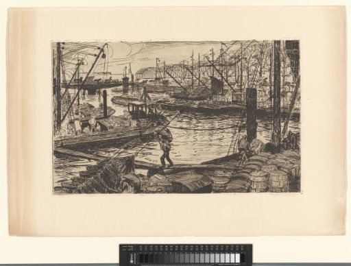 Workers at work on boats in a harbour