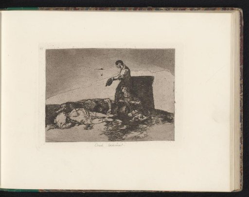 Woman and man near bodies of fallen men