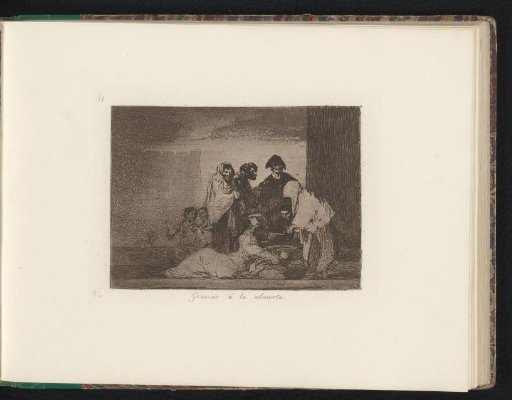 Refugees sharing food at a cooking pot